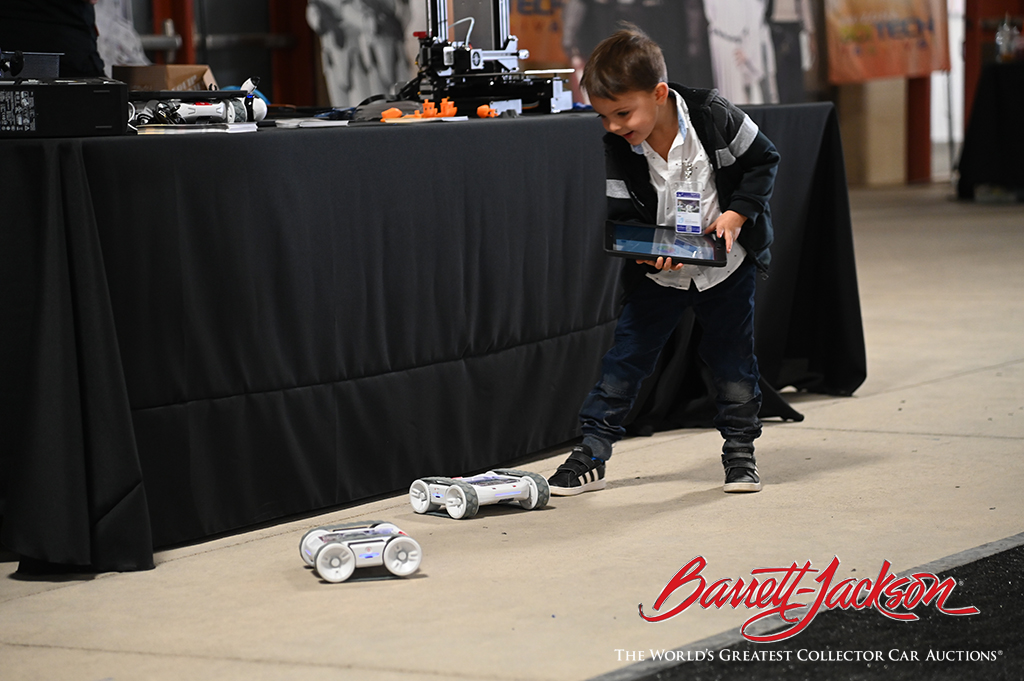 Child playing with robots during STEM Fest.
