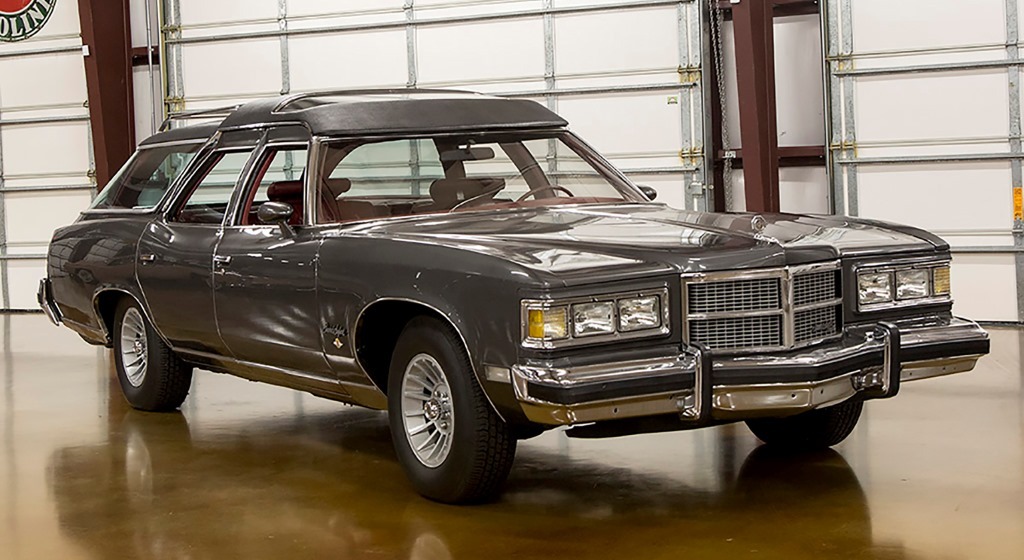 A larger-than-life movie star needed a larger-than-life car - so John Wayne had this 1975 Pontiac Safari Station Wagon (Lot #775) customized by George Barris to fit his needs - and size.