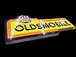 Superb 1940s-50s Oldsmobile GM Hydramatic Drive single-sided porcelain neon dealership sign. - Front 3/4 - 113177