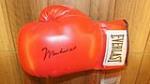 Muhammad Ali autographed Everlast boxing glove. Signed at Barrett-Jackson by Mr. Ali for Ron Pratte.  Condition: Never Used - Front 3/4 - 179199
