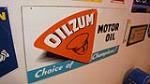 N.O.S. Oilzum Motor Oil "Choice of Champions" single-sided tin wood framed back automotive garage sign. - Front 3/4 - 179322