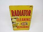 Circa late 1950s Radiator Cleaning Repair with a period Plymouth depicted. - Front 3/4 - 202835