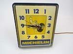 Late 1970s Michelin Tires light-up garage clock with Bibendum (Michelin Man) graphic. - Front 3/4 - 202922