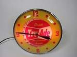 Very clean 1958 Drink Tru-Ade Orange Soda glass-faced light-up diner clock by Pam. - Front 3/4 - 203596