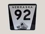Exceptional Nebraska highway #92 reflective metal road sign with Pioneer covered wagon graphic. - Front 3/4 - 206933