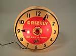 Neat 1950s Grizzly Brake Linings light-up service station clock with Grizzly Bear graphic. - Front 3/4 - 208860