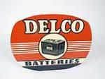 Wonderful 1948 Delco Batteries double-sided tin sign with period battery graphic. - Front 3/4 - 208964