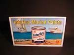 Spectacular N.O.S. 1950s Interlux Marine Paints single-sided tin marina sign with killer boating graphics. - Front 3/4 - 50574