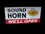 Choice 1965 Pennzoil "Sound Your Horn" single-sided tin painted garage sign. - Front 3/4 - 98004