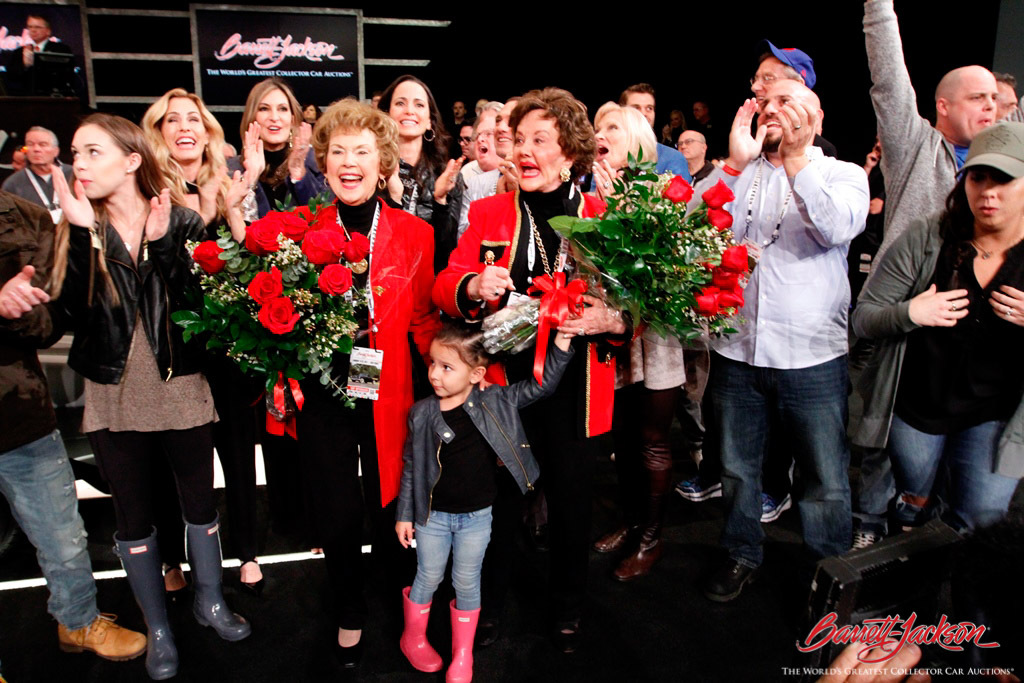 Yvonne Fedderson and Sara O'Meara cheer on the bidding for a 1970 Chevrolet Camaro (Lot #3001), which crossed the block to benefit the organization they founded, Childhelp.