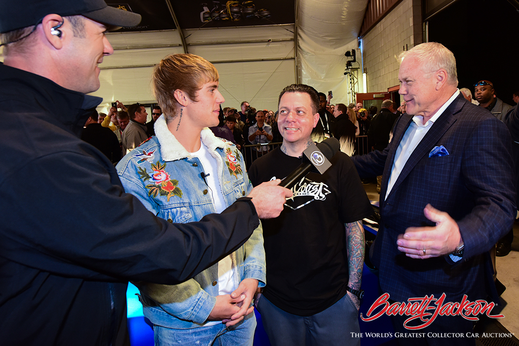 Discovery Channel's Chris Jacobs interviews Justin Bieber, West Coast Customs CEO Ryan Friedlinghaus and Craig Jackson in the staging lanes today.