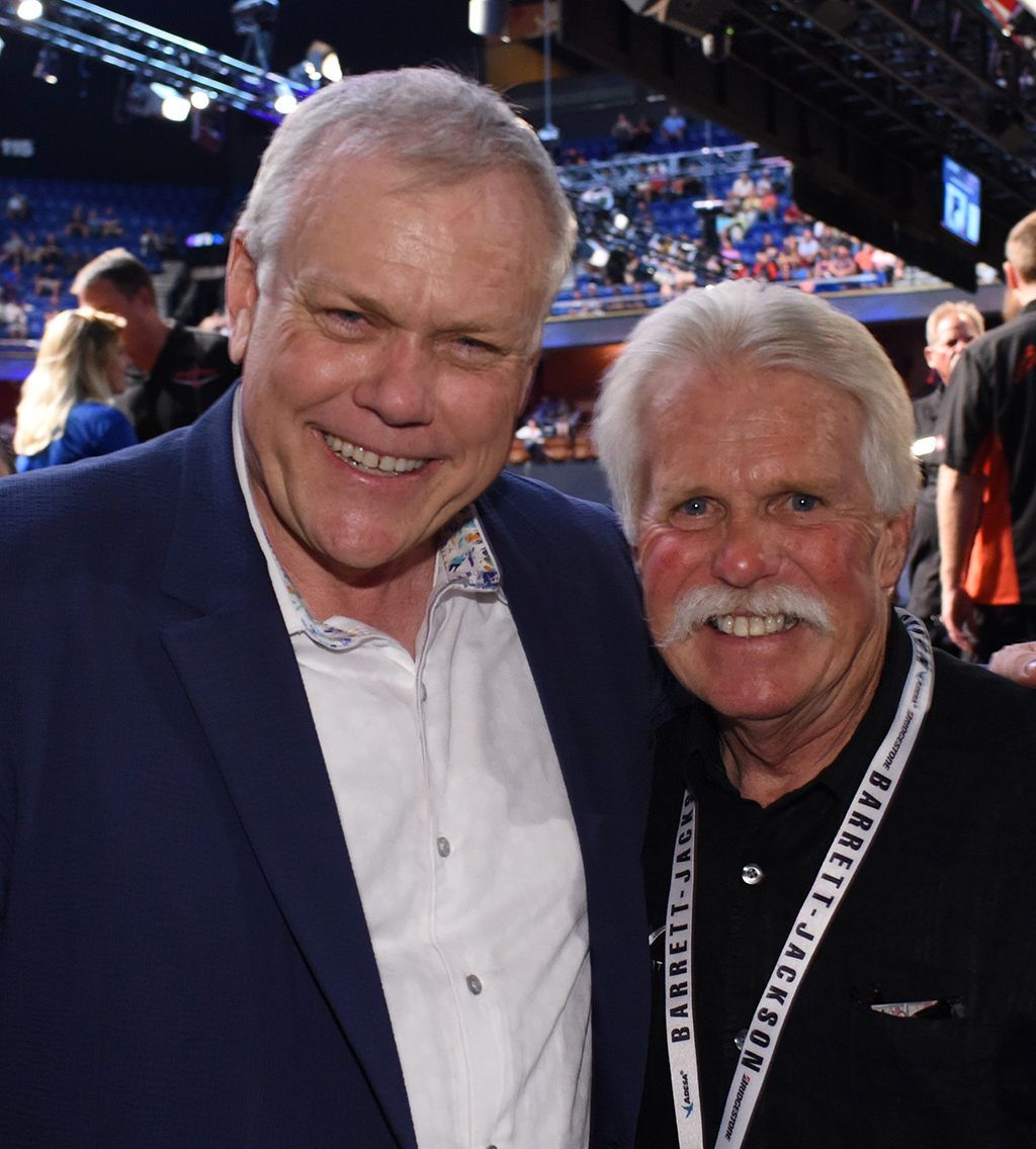 Wayne Carini of "Chasing Classic Cars" - shown here with Barrett-Jackson Chairman and CEO Craig Jackson at last year's Northeast Auction - will be one of many featured guests at the Behind The Hobby Collector Car Symposium on Friday, June 23.