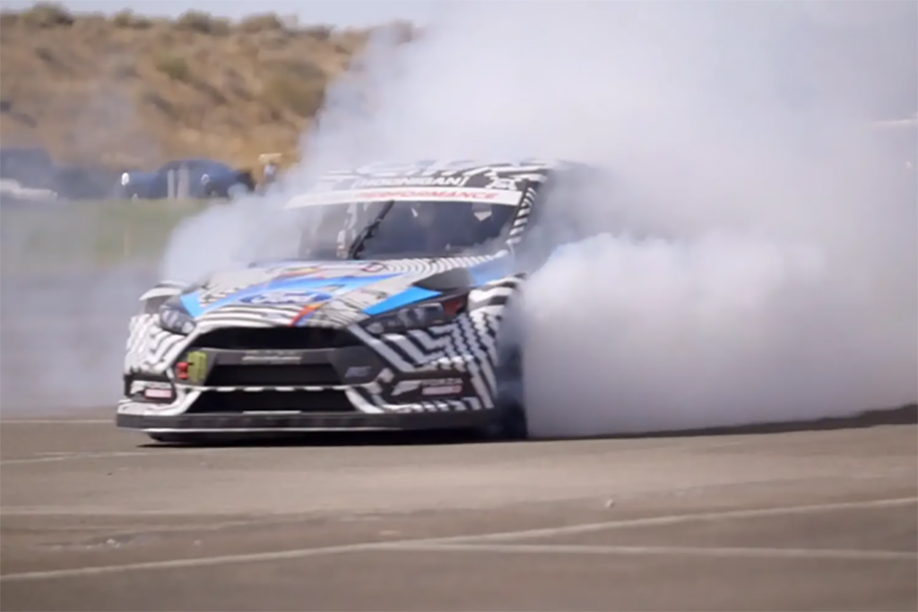 With Barrett-Jackson CEO Craig Jackson riding shotgun, famed rallycross driver Ken Block took his 2016 Ford Focus RS RX for one last donut-filled spin before it sold for $200,000 to benefit Team Rubicon.