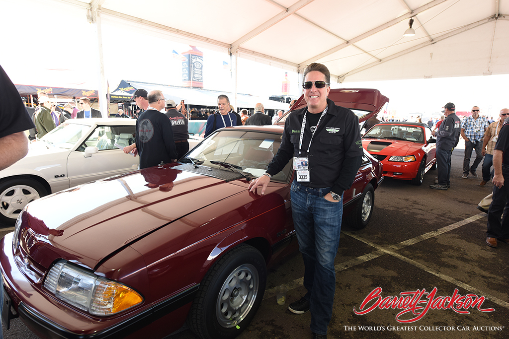 Gas Monkey Garage's Dennis Collins with one of the eight Mustangs he brought to the block - six of which set new world records at auction.