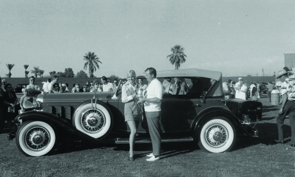 Tom Barrett with the woman crowned “Miss Classy Chassis” at the Fiesta de los Autos Elegantes in the late 1960s