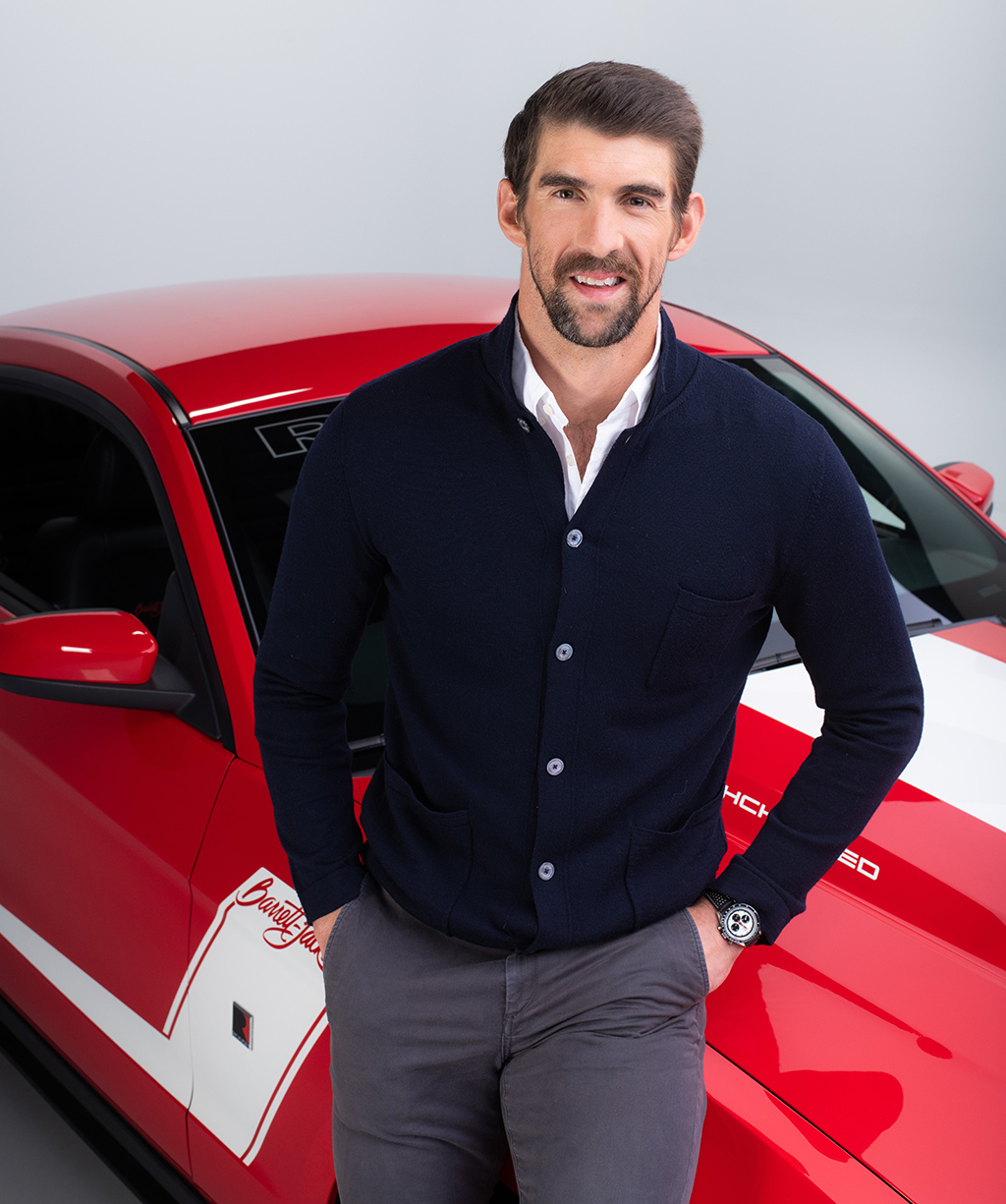 Olympic great Michael Phelps with the Ford Roush Mustang Barrett-Jackson Edition.