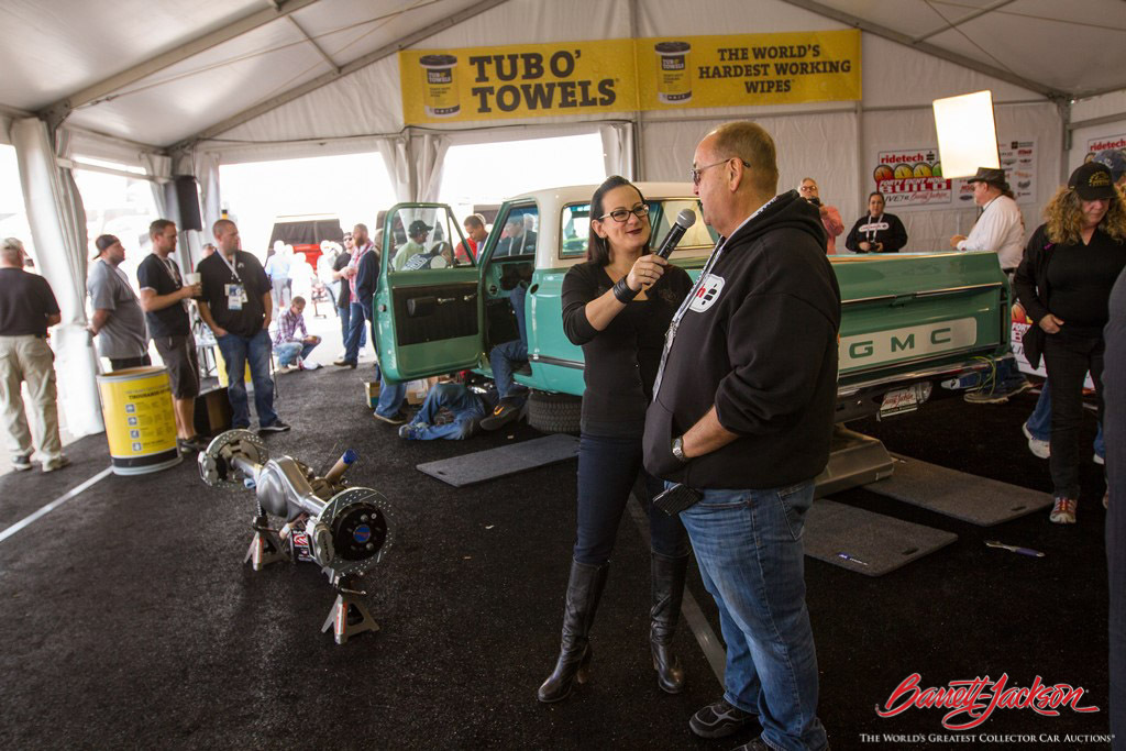 Bogi from "All Girls Garage" interviews a RideTech team member in the new DIY Pavilion about their 48-hour build of a 1968 GMC C-10 Pickup that crossed the block as Lot #7005 on the final day of the auction.