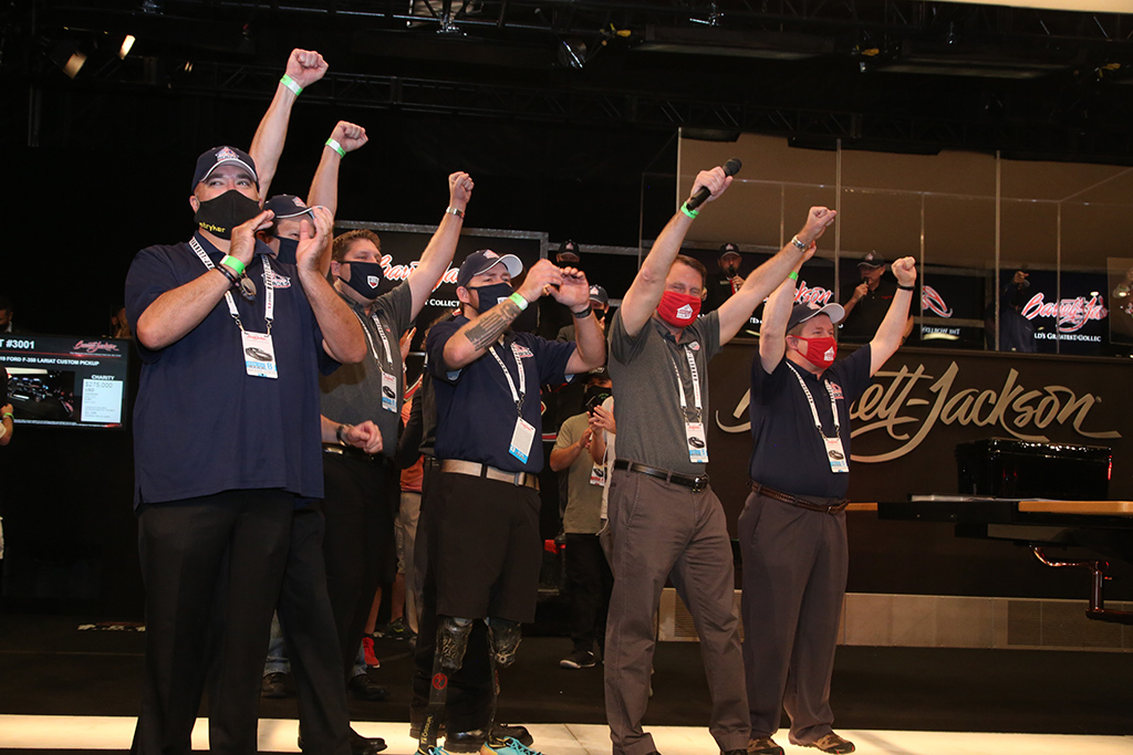 Truck Hero and Building Homes for Heroes representatives couldn't contain their excitement when the "Ultimate Tailgate Truck" sold for $275,000.