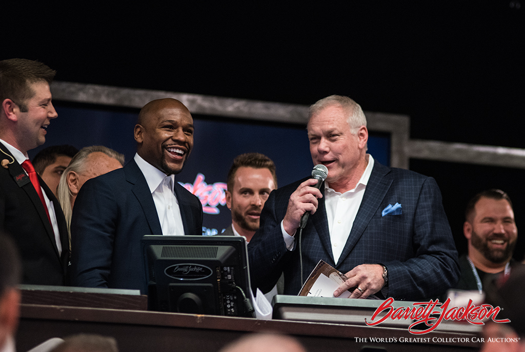 Lead auctioneer Joseph Mast, pro boxing champion Floyd Mayweather and Craig Jackson.