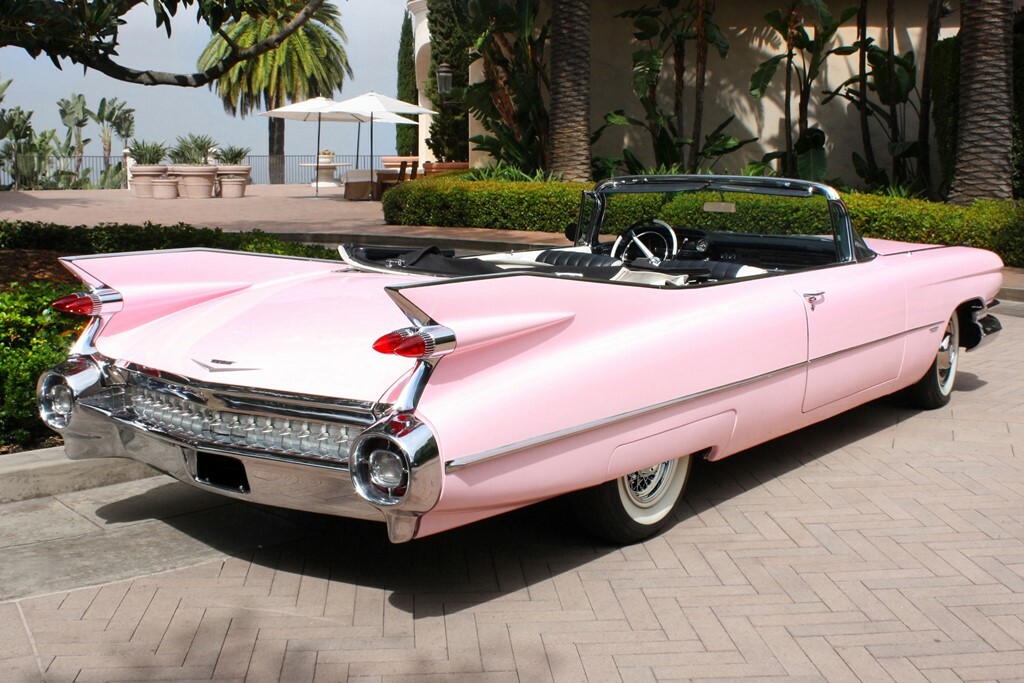 Nothing says '50s more than a pink Cadillac! This 1959 Cadillac Series 62 convertible (Lot #759) has been fully restored.