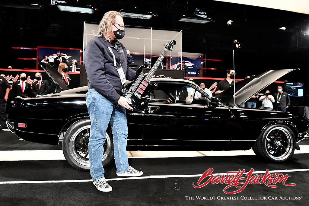 FENDER CUSTOM SHOP DIRECTOR AND PRINCIPAL MASTER BUILDER RON THORN HOLDS A CUSTOM 1969 FENDER STRATOCASTER THAT SOLD WITH THE BARRETT-JACKSON BUILDS 1969 FORD MUSTANG FENDER CUSTOM FASTBACK FOR $148,500.