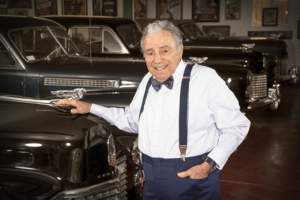 "Uncle” Phil Maloof with his treasured car collection.