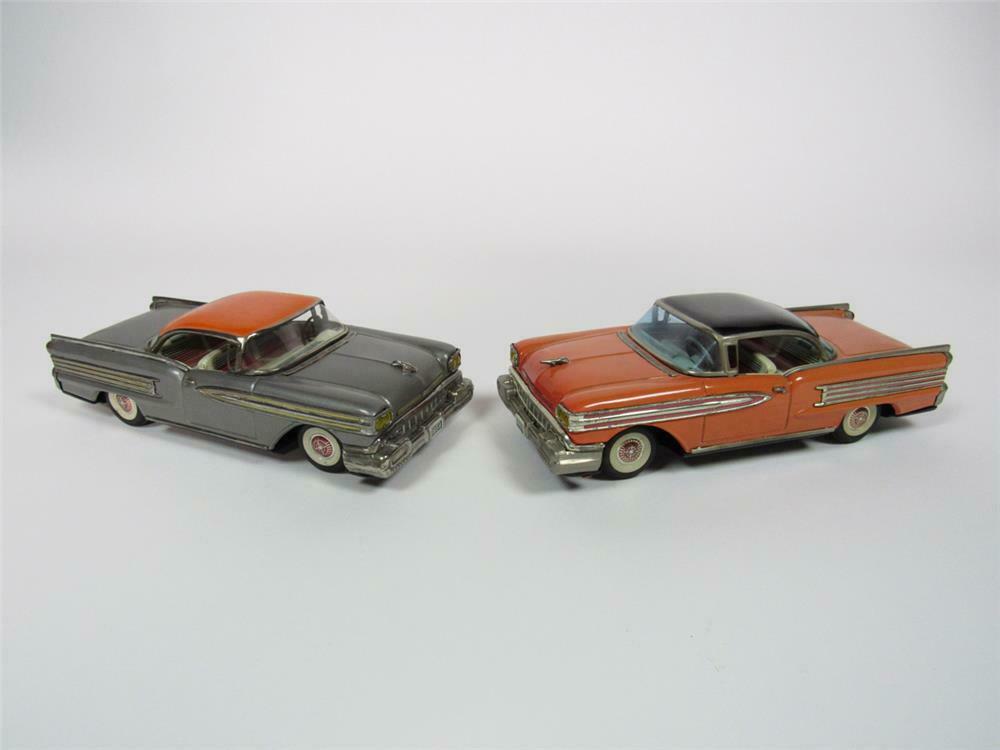 Lot of two 1950s Cadillacs tin litho friction toy cars in all