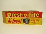 Fabulous NOS early 1950s Prestolite batteries single-sided embossed tin garage sign. - Front 3/4 - 211395