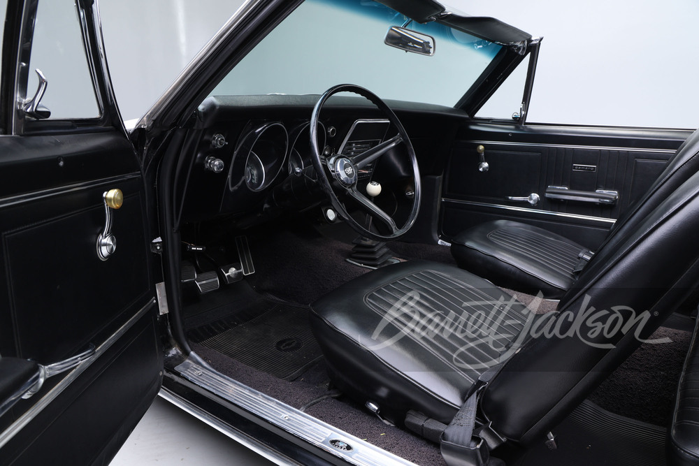 Interior view of Linda Perry's 1967 Chevrolet Camaro SS convertible, showing the four-speed manual shifter